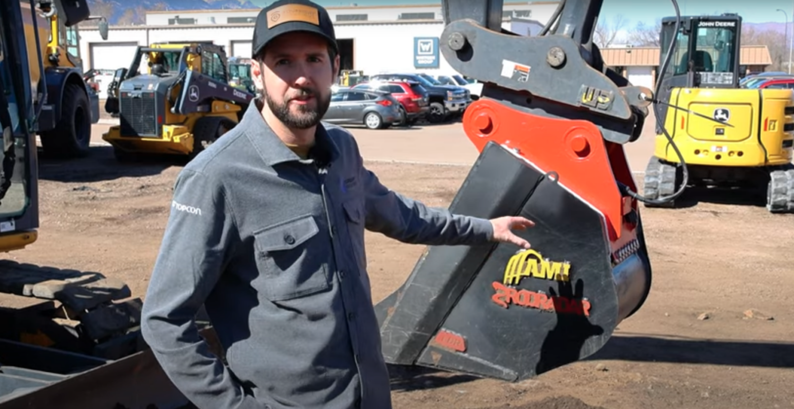 FourSight's Mike Sydow standing beside the RodRadar excavator bucket.